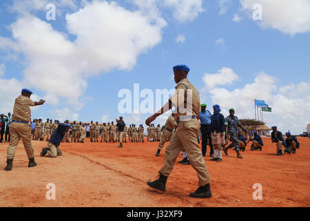 New recruits for the Somali Police Force (SPF) demonstrate skills acquired during their training during a passing out parade to mark the completion of their training in Kismaayo on April 24, 2017. AMISOM Photo Stock Photo