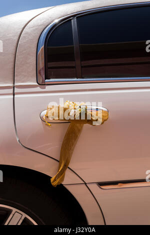 White Lincoln limousine car decorated for a wedding party Stock Photo