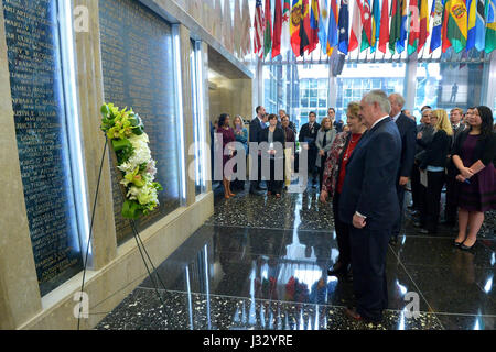 After delivering welcome remarks to State Department employees on his first day, U.S. Secretary of State Rex Tillerson and his wife, Renda St. Clair, pause for a moment of silence to honor Americans who lost their lives in the line of duty while serving the U.S. Government and the American people abroad, in front of the American Foreign Service Association (AFSA) Memorial Plaque in the main lobby of the Department's Harry S. Truman building in Washington, D.C., on February 2, 2017. Stock Photo