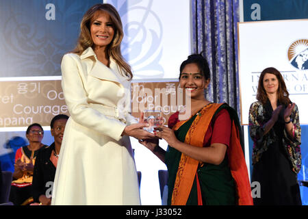 First Lady Melania Trump poses for a photo with 2017 International Women of Courage Awardee Sharmin Akter of Bangladesh during a ceremony at the U.S. Department of State in Washington, D.C., on March 29, 2017. Stock Photo