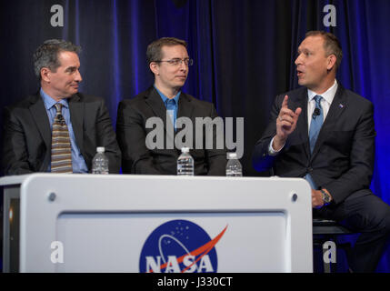 Manager of NASA's Spitzer Science Center at Caltech/IPAC, Pasadena, California Sean Carey, left, University of Liege in Belgium Astronomer Michael Gillon, center, and NASA Associate Administrator of the Science Mission Directorate Thomas Zurbuchen present research findings during a TRAPPIST-1 planets briefing, Wednesday, Feb. 22, 2017 at NASA Headquarters in Washington. Researchers revealed the first known system of seven Earth-size planets around a single star called TRAPPIST-1. Photo Credit: (NASA/Bill Ingalls)  More: exoplanets.nasa.gov/trappist1/ ( https://exoplanets.nasa.gov/trappist1/ ) Stock Photo