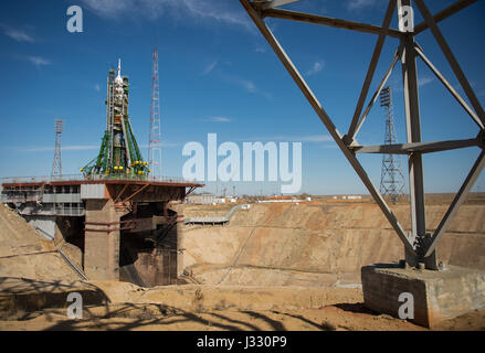 The Soyuz MS-04 spacecraft is seen after the gantry arms closed around the rocket to secure it at the launch pad on Monday, April 17, 2017 at the Baikonur Cosmodrome in Kazakhstan.  Launch of the Soyuz rocket is scheduled for April 20 Baikonur time and will carry Expedition 51 Soyuz Commander Fyodor Yurchikhin of Roscosmos and Flight Engineer Jack Fischer of NASA into orbit to begin their four and a half month mission on the International Space Station. Photo Credit: (NASA/Aubrey Gemignani) Stock Photo