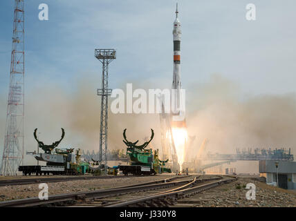 The Soyuz MS-04 rocket launches from the Baikonur Cosmodrome in Kazakhstan on Thursday, April 20, 2017 Baikonur time carrying Expedition 51 Soyuz Commander Fyodor Yurchikhin of Roscosmos and Flight Engineer Jack Fischer of NASA into orbit to begin their four and a half month mission on the International Space Station. (Photo Credit: NASA/Aubrey Gemignani) Stock Photo