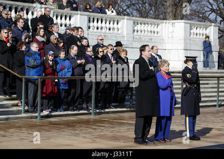 NASA personnel watch as a wreath is laid at the Tomb of the Unknowns by acting NASA Administrator Robert Lightfoot and June Scobee-Rodgers,  as part of NASA's Day of Remembrance, Tuesday, Jan. 31, 2017, at Arlington National Cemetery in Arlington, Va.  The wreaths were laid in memory of those men and women who lost their lives in the quest for space exploration. Stock Photo