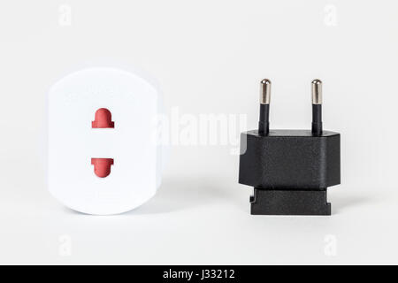 Two pin electrical plug with adaptor on white background Stock Photo