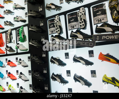Puma football boots dispay in Sports Direct store. UK Stock Photo - Alamy