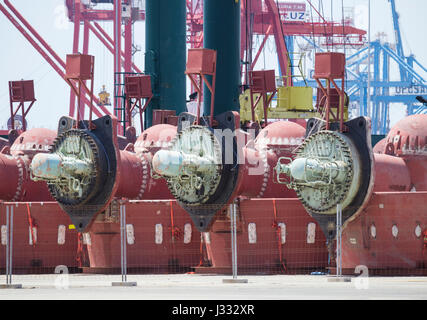 Oil rig thrusters removed from mothballed rigs and stored on dry land Stock Photo