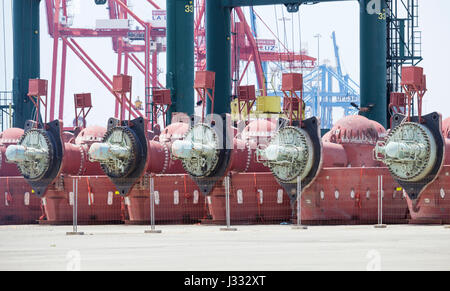 Oil rig thrusters removed from mothballed rigs and stored on dry land Stock Photo