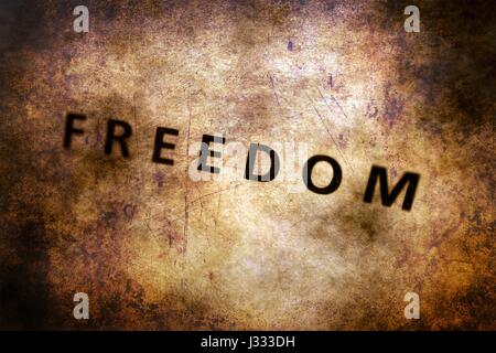 Freedom text on grunge background Stock Photo