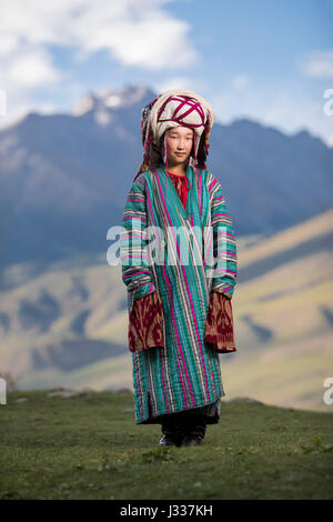 Kyrgyz pose for portraits in traditional regional clothing at a cultural celebration at the World Nomad Games 2016 in Kyrchyn Gorge. Stock Photo