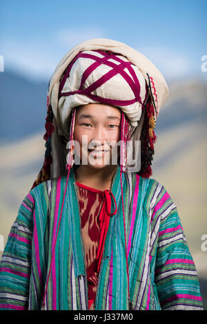 Kyrgyz pose for portraits in traditional regional clothing at a cultural celebration at the World Nomad Games 2016 in Kyrchyn Gorge. Stock Photo