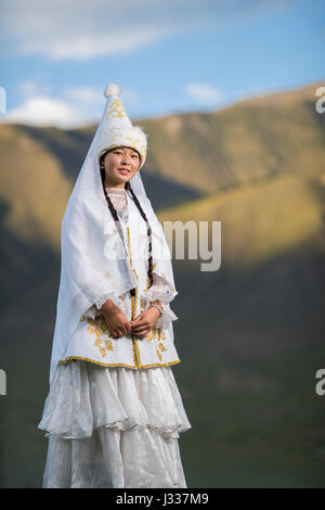 Kyrgyz pose for portraits in traditional regional clothing at a ...