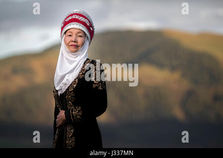 Kyrgyz pose for portraits in traditional regional clothing at a ...