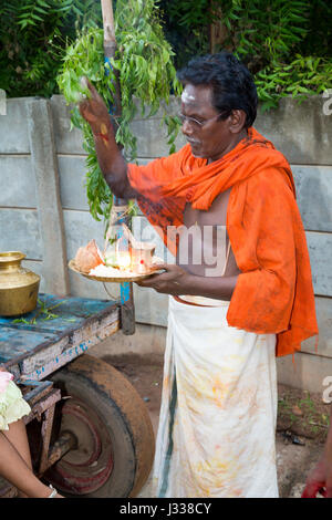 Illustrative image. Pondicherry, Tamil Nadu, India - April 14, 2014. Temple festival at Pondicherry, people in the street dancing meditating priest Stock Photo