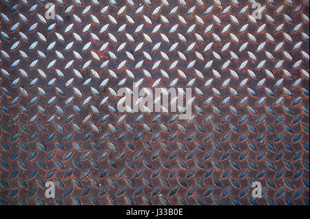 Background of metal diamond plate in silver and red color Stock Photo