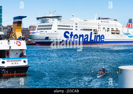 Rower, the ferry to Sweden and the passenger ferry on the Kieler Förde in the harbour, Kiel, Schleswig Holstein, Germany Stock Photo