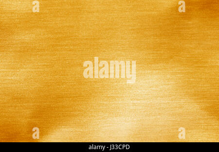 Shiny hot yellow gold foil golden color glitter decorative texture paper Stock Photo