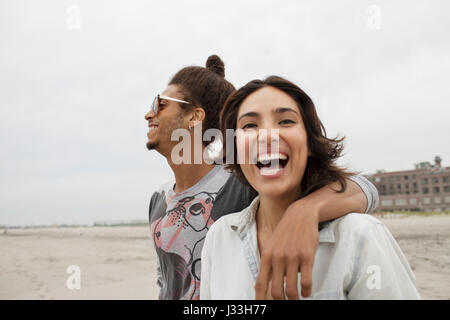 Young couple hanging out at the beach Stock Photo