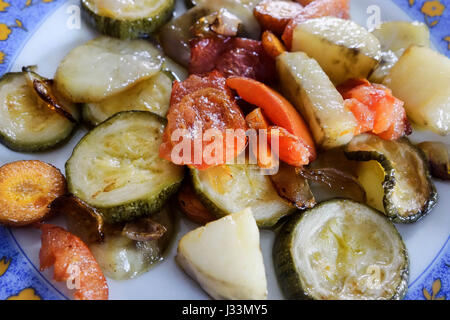 Greek Cuisine. Baked Courgettes with Potatoes, Tomatoes and Carrot Stock Photo