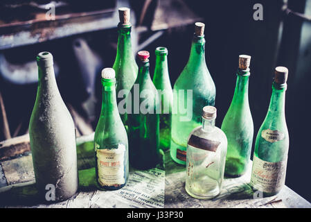 empty green bottles - objects and places lost in time Stock Photo