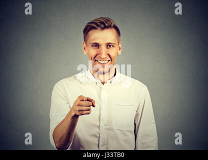 Portrait of a young man pointing his finger at you Stock Photo