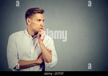 Preoccupied anxious young man Stock Photo