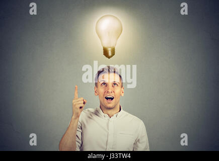 Young business man with idea solution and light bulb over his head Stock Photo