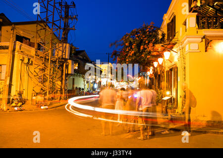 HOI AN, VIETNAM - MARCH 15: People on the street of Hoi An ancient town with long exposure effect, UNESCO World Heritage Site on March 15, 2014 in Hoi Stock Photo