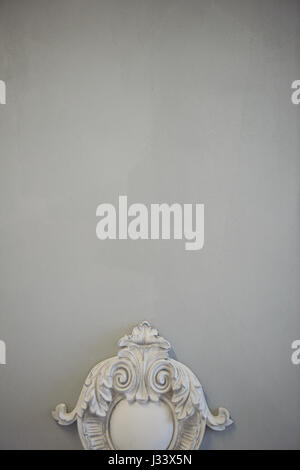 Decorative molding ornaments on the gray wall. Classic decor. Retro Stock Photo