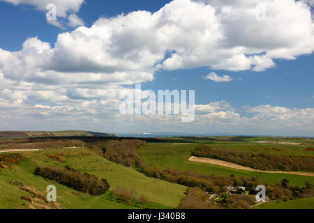 Fresh green sweeping landscape with attractive sky easterly from Swyre Head towards distant Isle of Wight, Dorset UK Stock Photo