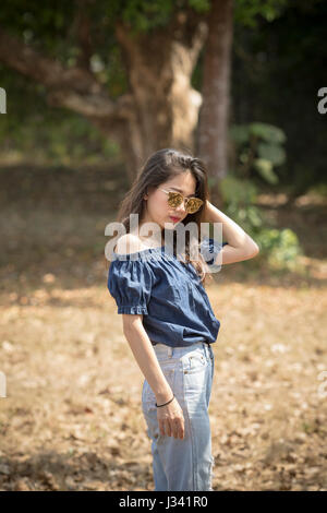 portrait of young beautiful asian woman model wearing sun glasses Stock Photo