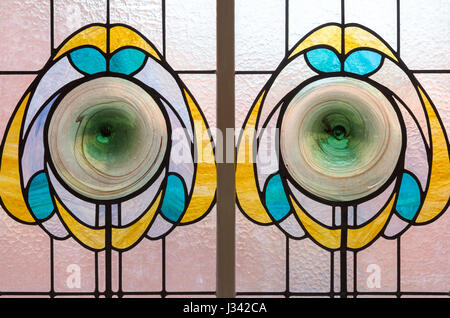 Stylised flowers depicted in stained glass, Victoria Baths, Manchester, England. Stock Photo