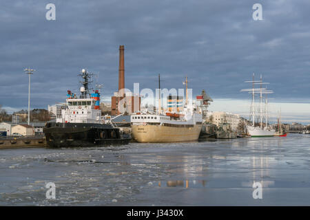 Turku and Swan of Finland (Suomen Joutsen) seen at the mouth of Aura river in February 2017, Finland Stock Photo