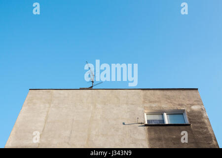 Looking up towards the grey facade of socialist housing in eastern europe. Wroclaw, Poland. Stock Photo