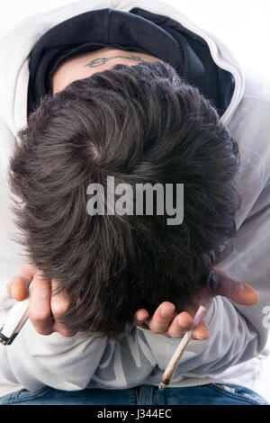 young man experiencing a tobacco drug problem Stock Photo