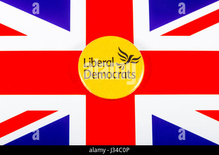 LONDON, UK - MAY 2ND 2017: A Liberal Democrats pin badge over the UK flag, on 2nd May 2017. Stock Photo