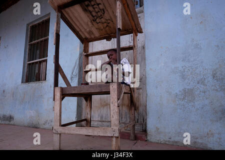 A young boy in Barrio da Mafalala a poor slum of Maputo, the capital city of Mozambique Africa Stock Photo