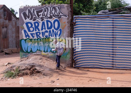 An alley in Barrio da Mafallala a poor slum of Maputo, the capital city of Mozambique Africa Stock Photo