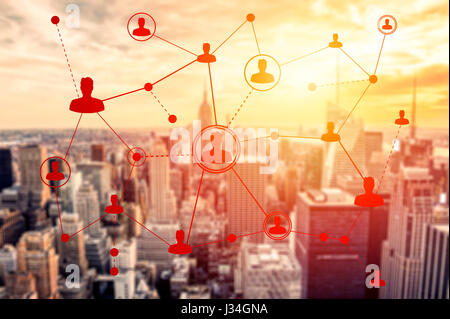 Social networking technologies on a sunset in New York. Social media concept Stock Photo