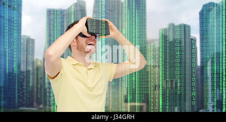 happy man in virtual reality headset or 3d glasses Stock Photo