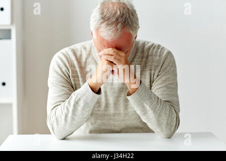 close up of senior man thinking Stock Photo