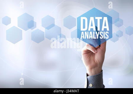 hand touching a touch screen interface with data analysis Stock Photo