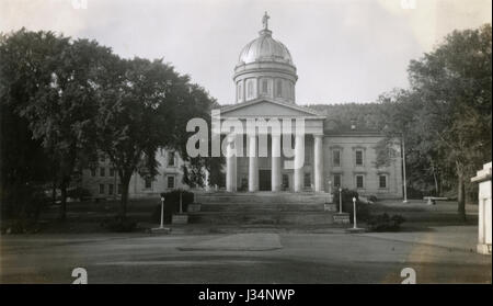 Antique July 4, 1937 photograph of the Vermont State House. The Vermont State House, located in Montpelier, is the state capitol of Vermont, in the United States. It is the seat of the Vermont General Assembly. The current Greek Revival structure is the third building on the same site to be used as the State House. Designed by Thomas Silloway in 1857-1858, it was occupied in 1859. SOURCE: ORIGINAL PHOTOGRAPH. Stock Photo