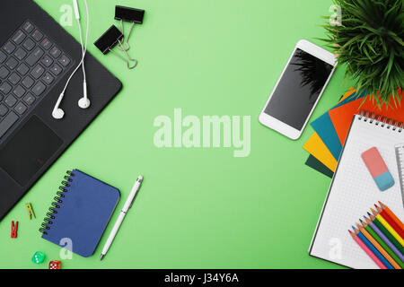 Stationery on a green table Stock Photo