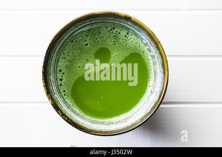 Green matcha tea in bowl. Stock Photo