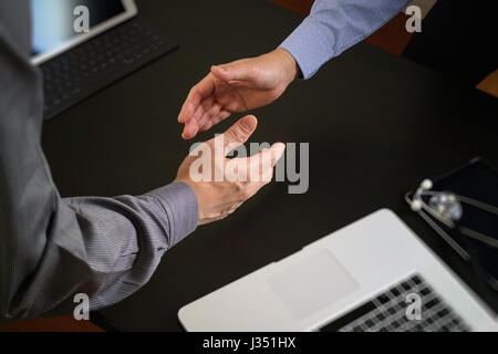 Medical and healthcare concept,Doctor and patient shaking hands in modern office at hospital Stock Photo