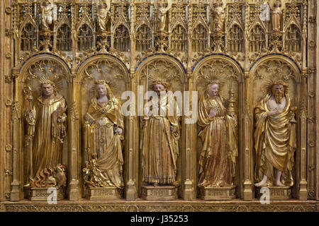 Saint Anthony, Saint Margaret the Virgin, saint king, Saint Barbara and Saint Judoc depicted from left to right in the right wing of the Altarpiece of the Crucifixion from the Chartreuse de Champmol by Flemish Renaissance sculptor Jacques de Baerze (1390-1399) on display in the Musee des Beaux-Arts de Dijon (Museum of Fine Arts) in Dijon, Burgundy, France. Stock Photo