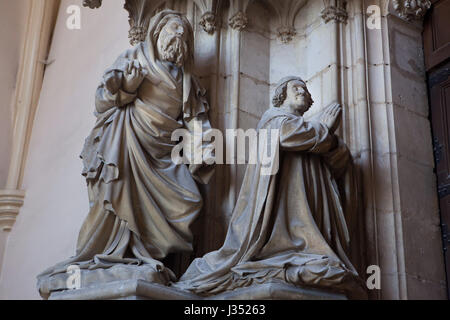 Saint John the Baptist (L) and Duke Philip II of Burgundy (R). Detail of the memorial to Philip the Bold by Dutch Renaissance sculptor Claus Sluter at the portal of the monastery church in the Chartreuse de Champmol in Dijon, Burgundy, France. Stock Photo