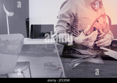 Man using VOIP headset with digital tablet and laptop computer as concept communication,it support,call center and customer service help desk with Lon Stock Photo