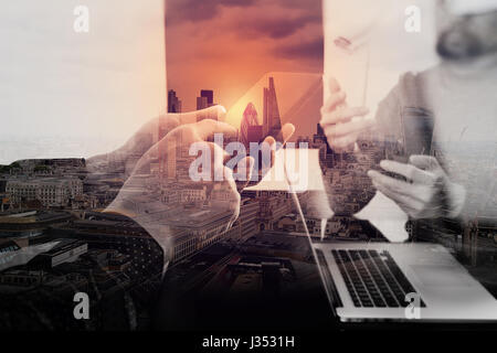 co working team meeting concept,businessman using smart phone in modern office with London exposure Stock Photo